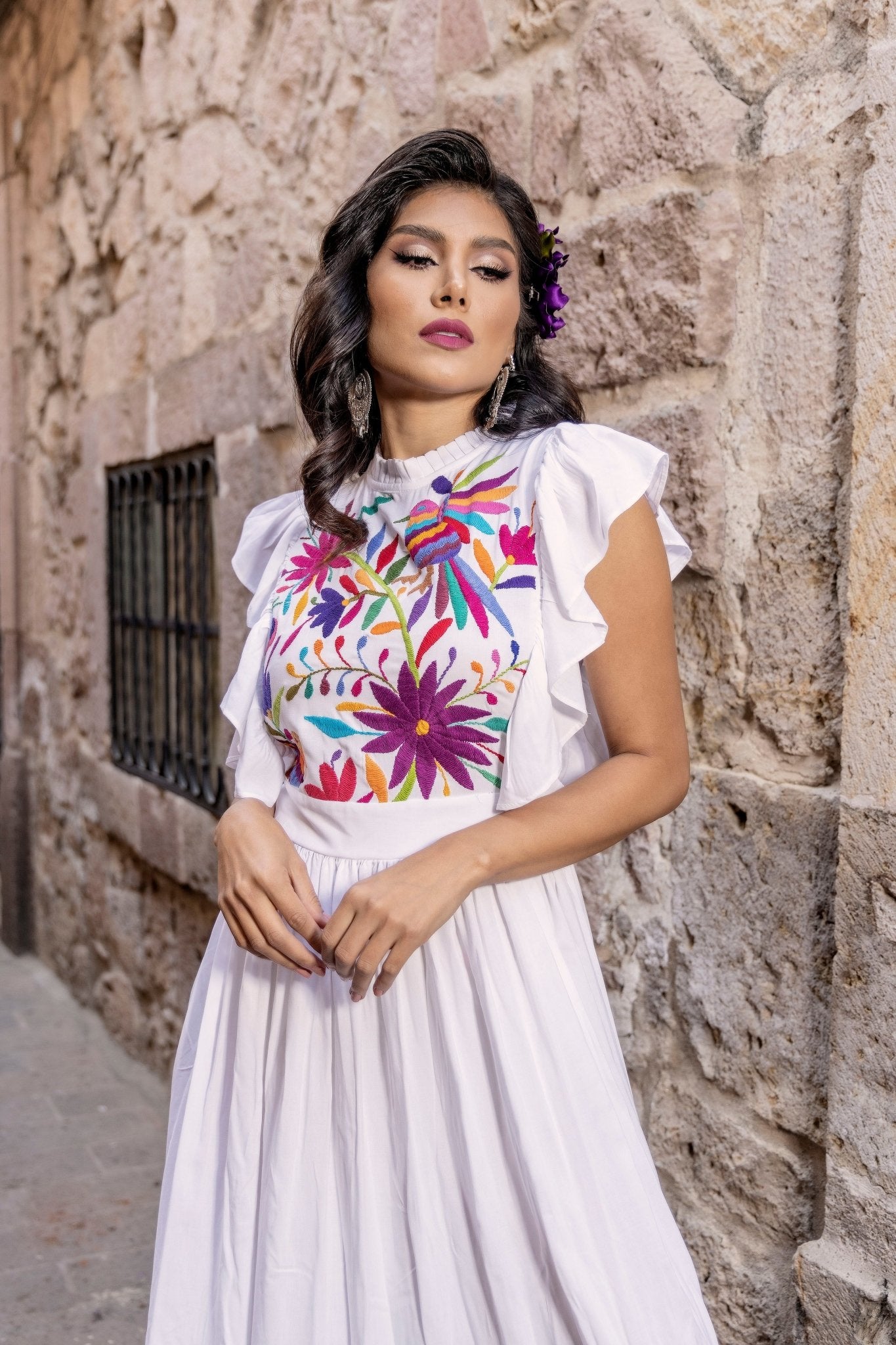 White dress orders with colorful embroidery